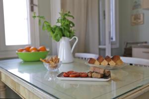 a counter with two plates of food on a table at Camara Homes in Andros