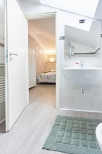 Postel nebo postele na pokoji v ubytování HOTEL Villa Lilla