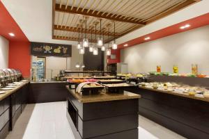 
a kitchen filled with lots of counter top space at Ramada Downtown Dubai in Dubai
