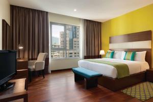 Letto o letti in una camera di Ramada by Wyndham Downtown Dubai