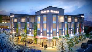 a rendering of a building with people walking in front of it at Ramada Suites by Wyndham Queenstown Remarkables Park in Queenstown