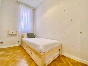 Un pat sau paturi într-o cameră la Charming Atocha II