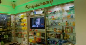 a pharmacyacist with a television in a store at Hotel Riad Hannah in Marrakesh