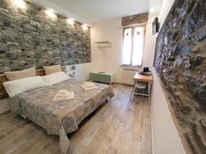 Łóżko lub łóżka w pokoju w obiekcie Affittacamere Albarola