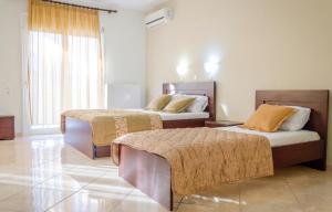 Postel nebo postele na pokoji v ubytování Delfini Hotel