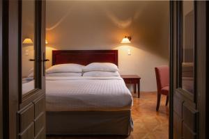 A bed or beds in a room at OREA Place Charles Bridge