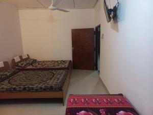 Postel nebo postele na pokoji v ubytování Mayura Rest Inn + 21 fotografií