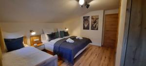 a hotel room with two beds and a closet at Haus Schober in Bad Hofgastein