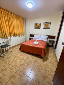 Postel nebo postele na pokoji v ubytování Hostal El Click