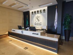 a lobby with a reception desk in a building at Friesian Hotel Apartments in Jeddah