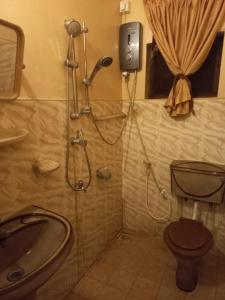 Koupelna v ubytování Mayura Rest Inn