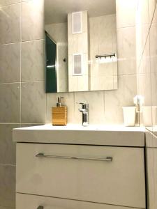 a bathroom with a sink and a mirror at Old Town Romantic Apartment. Breslau-Wroclaw. in Wrocław +33 photos