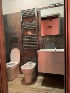 a bathroom with a toilet and a sink at Poste Regie - Milan Guest House in Milan