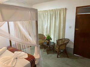 Postel nebo postele na pokoji v ubytování Una Beach Hotel & OLU Cafe
