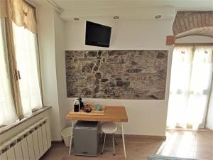 Telewizja i/lub zestaw kina domowego w obiekcie Affittacamere Albarola