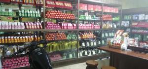 a store filled with lots of different types of drinks at Baan Ruam Cha in Mae Salong