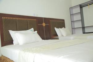 Letto o letti in una camera di GNS Hotel Kampala