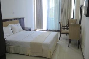 Letto o letti in una camera di GNS Hotel Kampala
