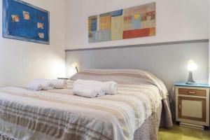 Krevet ili kreveti u jedinici u okviru objekta Santa Marinella - La Terrazza sul Mare