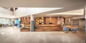a lobby of a hospital with a waiting room at Aminess Vival Maestral Hotel in Novigrad Istria