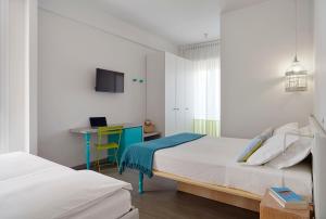 Postel nebo postele na pokoji v ubytování Hotel Madison