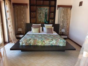 Кровать или кровати в номере La Villa Marie Joana