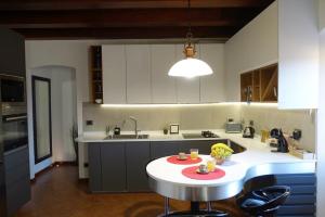 A kitchen or kitchenette at TUSCANY LOFT IN THE CITY