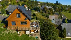 an aerial view of a house with a deck at Le Chalet de Juliette in Besse-et-Saint-Anastaise