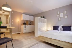 Postel nebo postele na pokoji v ubytování homie stay Julius Apartments - Iphofen