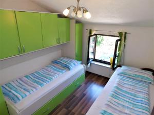 Łóżko lub łóżka w pokoju w obiekcie Apartman "Sabine" with heated pool