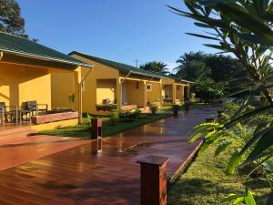 a wooden deck in front of a house at Quinta Santa Rita - Príncipe in Cascalheira