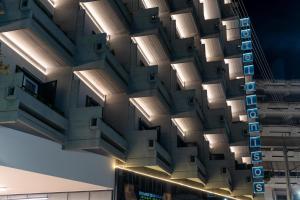 a building with a bunch of lights on it at Dionisos Hotel in Larisa