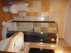 a bathroom with a sink and a toaster at Mirex in Krynica Zdrój