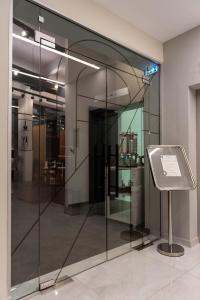 a glass display case in a museum with a sign at Dionisos Hotel in Larisa