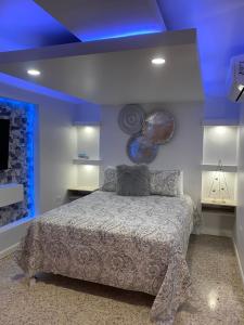 Itza-Bella Suites 객실 침대
