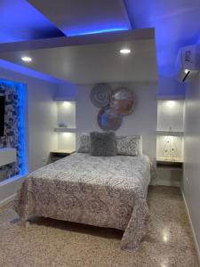 Itza-Bella Suites 객실 침대