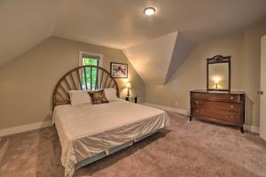 A bed or beds in a room at Manistee House Less Than 1 Mile from Lake Michigan!