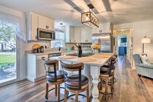 a kitchen with a table and some chairs in a room at Warm and Cozy Buckeye Lake Home Yard and Patios! in Hebron