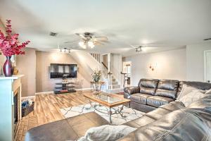 a living room with a leather couch and a coffee table at Gainesville Home with Outdoor Oasis, 16 Mi to Lake in Gainesville