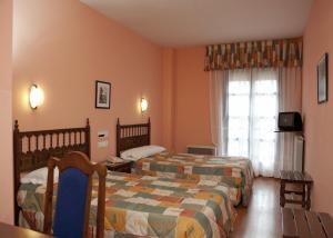Postel nebo postele na pokoji v ubytování Hotel Casa Aurelia