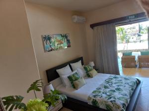 Кровать или кровати в номере La Villa Marie Joana