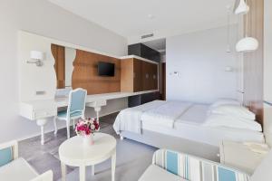 Postel nebo postele na pokoji v ubytování Hotel Bracera