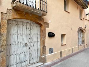 a building with a large door on the side of it at El Secret de la LLegenda El Drac in Vilavert