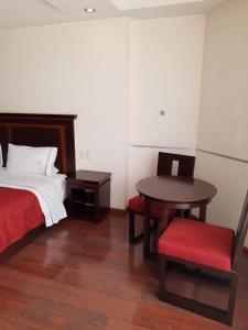 HOTEL MADEIRA客房内的一张或多张床位