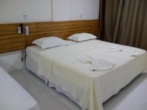 
A bed or beds in a room at Hotel Vista Bela
