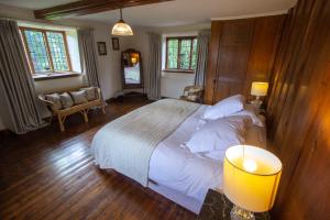 A bed or beds in a room at Stourton Manor