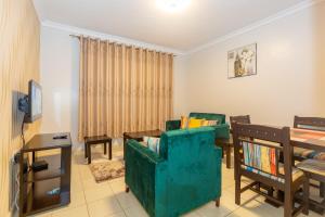 a living room with a couch and a table at Fully furnished 1-bedroom Apartment in Eldoret in Eldoret