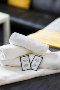 a pile of towels sitting on top of a table at Dunes Hotel in Whitley Bay