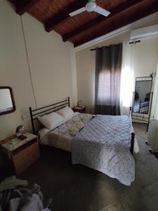 a bedroom with a large bed and a window at Near AirportAnd metropolitan Penelopi Cozy Home in Artemida