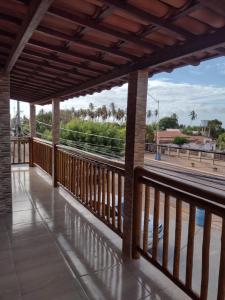a balcony with a view of the street at Pousada Estrela da manhã in São Miguel do Gostoso +21 photos